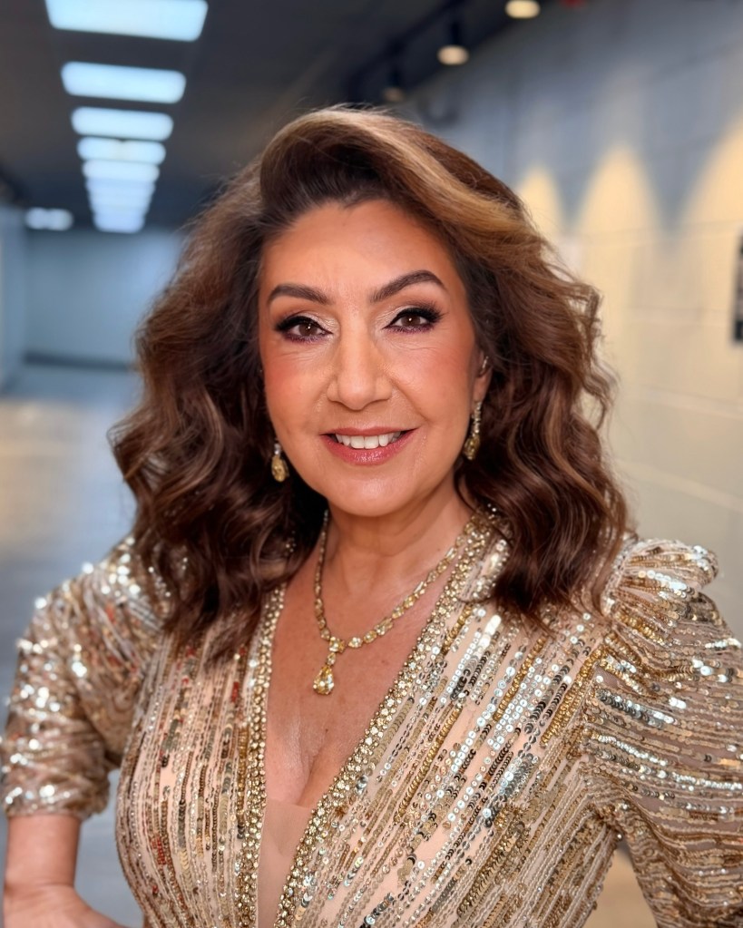 Jane McDonald backstage in a gold sequin dress after her brow treatment