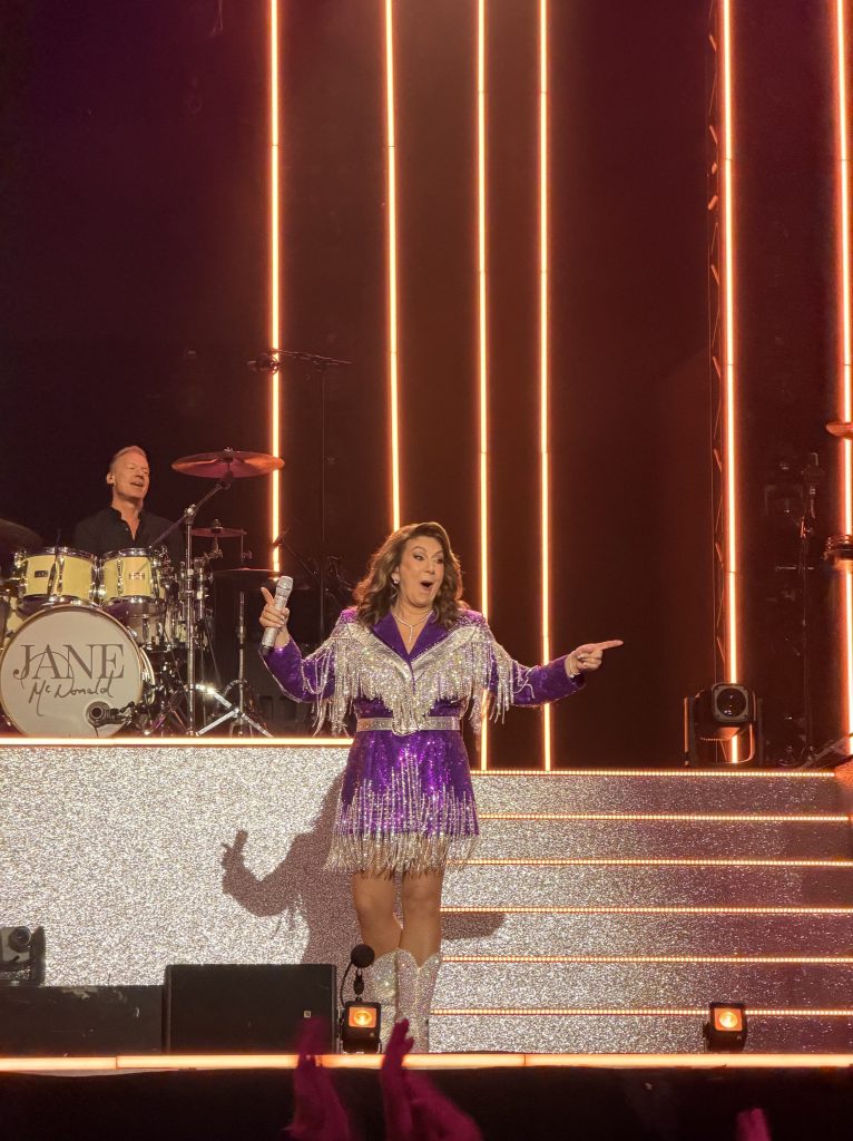 Jane McDonald on stage at the Leeds show, pointing out to the crowd